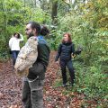 Group during a falconry animation at the park Les Aigles du Léman. They wear a bird with a glove: great horned owl and little owl.